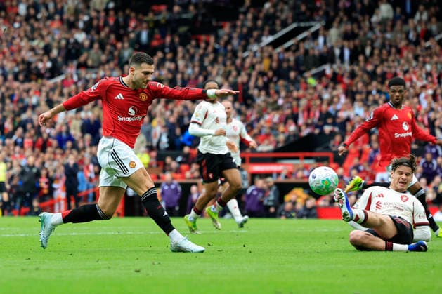 Manchester United, ManU v Liverpool, Premier League Diogo Dalot (2) of Manchester United has a shot on goal during the Premier League match between Manchester United and Liverpool at Old Trafford, Manchester, UK on 3 May 2026. Manchester Old Trafford Greater Manchester UK Editorial use only DataCo restrictions apply See www.football-dataco.com , Copyright: xConorxMolloyx PSI-24192-0095