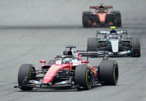 Monaco s Ferrari driver Charles Leclerc leads McLaren driver Lando Norris of Britain and Mercedes-AMG Petronas driver Kimi Antonelli of Italy at the start of the Formula One Miami Grand Prix at the Miami International Autodrome in Miami Gardens, Florida on Sunday, May 3, 2026.  MIA20260503907 GREGxNASH