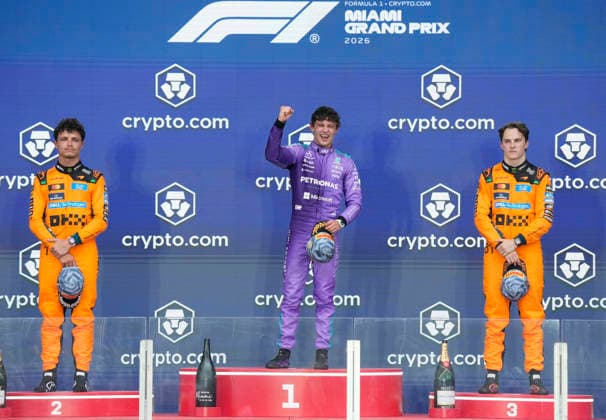 First place finisher Mercedes-AMG Petronas driver Kimi Antonelli of Italy (C), second place finisher McLaren driver Lando Norris of Britain (L) and third place finisher McLaren driver Oscar Piastri of Australia stand on the podium after the Formula One Miami Grand Prix at the Miami International Autodrome in Miami Gardens, Florida on Sunday, May 3, 2026. This was Antonelli s third Formula One victory in a row.  MIA20260503915 GREGxNASH