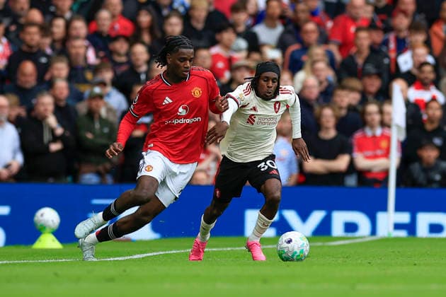 Manchester United, ManU v Liverpool, Premier League Ayden Heaven (26) of Manchester United is challenged by Jeremie Frimpong (30) of Liverpool during the Premier League match between Manchester United and Liverpool at Old Trafford, Manchester, UK on 3 May 2026. Manchester Old Trafford Greater Manchester UK Editorial use only DataCo restrictions apply See www.football-dataco.com , Copyright: xConorxMolloyx PSI-24192-0181
