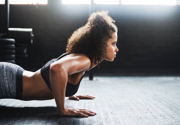 If its worth it youll work for it. a young woman doing pushups in a gym (License=RF) 19870180 ,model released, Symbolfoto  Copyright: xZoonar.com YurixArcursxpeopleimages.comx 19870180 ,model released, Symbolfoto ,property released