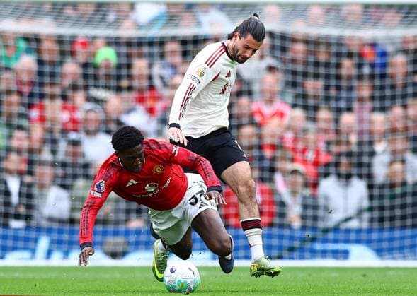 Kobbie Mainoo of Manchester United, ManU and Dominik Szoboszlai of Liverpool Manchester United v Liverpool, Premier League, Football, Old Trafford, Manchester , UK - 03 May 2026Manchester Old Trafford United Kingdom EDITORIAL USE ONLY No use with unauthorised audio, video, data, fixture lists, club league logos or live services. Online in-match use limited to 120 images, no video emulation. No use in betting, games or single club league player publications.  Copyright: xMattxWest Shutterstockx 16854589bt