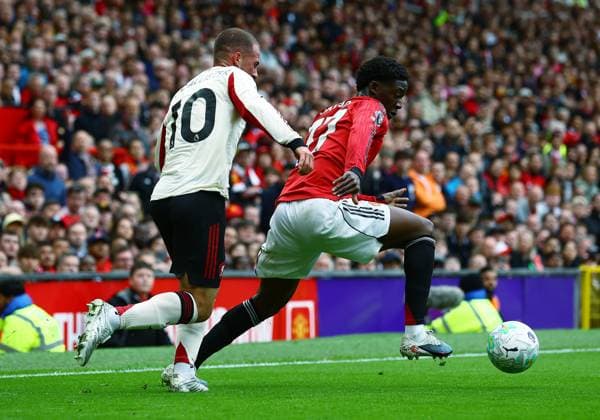 Kobbie Mainoo of Manchester United, ManU and Alexis Mac Allister of Liverpool Manchester United v Liverpool, Premier League, Football, Old Trafford, Manchester , UK - 03 May 2026Manchester Old Trafford United Kingdom EDITORIAL USE ONLY No use with unauthorised audio, video, data, fixture lists, club league logos or live services. Online in-match use limited to 120 images, no video emulation. No use in betting, games or single club league player publications.  Copyright: xMattxWest Shutterstockx 16854589dd