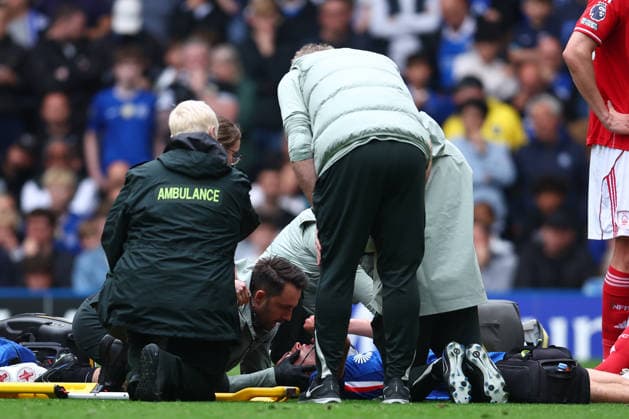 London, England, 4th May 2026. Jesse Derry of Chelsea receives medical attention before being stretchered off during the Chelsea vs Nottingham Forest Premier League match at Stamford Bridge, London. Picture credit should read: Paul Terry Sportimage EDITORIAL USE ONLY. No use with unauthorised audio, video, data, fixture lists, club league logos or live services. Online in-match use limited to 120 images, no video emulation. No use in betting, games or single club league player publications. SPI_025_PT_Chelsea_Notts_Forest SPI-4780-0025