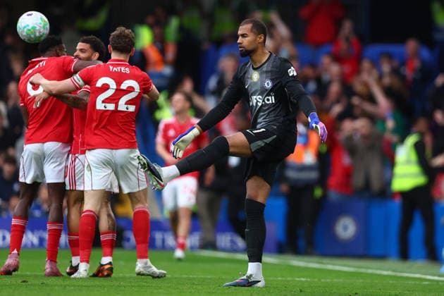 London, England, 4th May 2026. Robert Sanchez of Chelsea kicks the ball away in frustration as Taiwo Awoniyi of Nottingham Forest celebrates after scoring to make it 3-0 during the Chelsea vs Nottingham Forest Premier League match at Stamford Bridge, London. Picture credit should read: Paul Terry Sportimage EDITORIAL USE ONLY. No use with unauthorised audio, video, data, fixture lists, club league logos or live services. Online in-match use limited to 120 images, no video emulation. No use in betting, games or single club league player publications. SPI_042_PT_Chelsea_Notts_Forest SPI-4780-0042