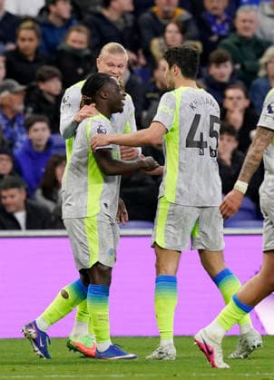 Liverpool, England, 4th May 2026. Erling Haaland of Manchester City hugs goalscorer Jeremy Doku of Manchester City during the Everton vs Manchester City Premier League match at Hill Dickinson Stadium, Liverpool. Picture credit should read: Andrew Yates Sportimage EDITORIAL USE ONLY. No use with unauthorised audio, video, data, fixture lists, club league logos or live services. Online in-match use limited to 120 images, no video emulation. No use in betting, games or single club league player publications. SPI_021_AY_Everton_Man_City SPI-4779-0021
