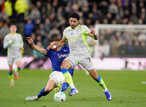 Liverpool, England, 4th May 2026. Vitalii Mykolenko of Everton tackles Omar Marmoush of Manchester City during the Everton vs Manchester City Premier League match at Hill Dickinson Stadium, Liverpool. Picture credit should read: Andrew Yates Sportimage EDITORIAL USE ONLY. No use with unauthorised audio, video, data, fixture lists, club league logos or live services. Online in-match use limited to 120 images, no video emulation. No use in betting, games or single club league player publications. SPI_048_AY_Everton_Man_City SPI-4779-0048