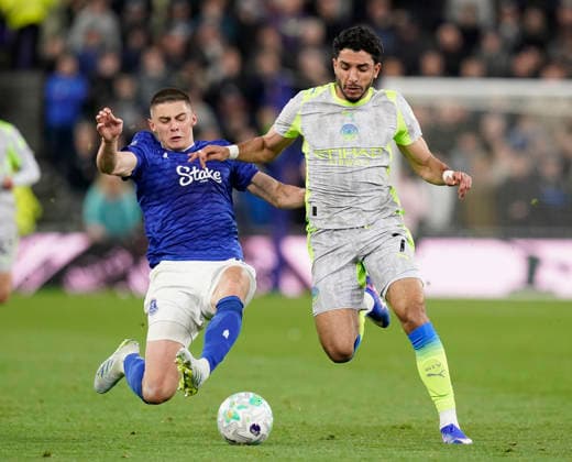 Liverpool, England, 4th May 2026. Vitalii Mykolenko of Everton tackles Omar Marmoush of Manchester City during the Everton vs Manchester City Premier League match at Hill Dickinson Stadium, Liverpool. Picture credit should read: Andrew Yates Sportimage EDITORIAL USE ONLY. No use with unauthorised audio, video, data, fixture lists, club league logos or live services. Online in-match use limited to 120 images, no video emulation. No use in betting, games or single club league player publications. SPI_049_AY_Everton_Man_City SPI-4779-0049