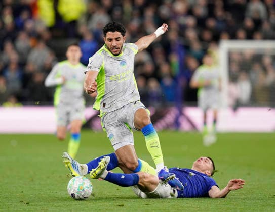 Liverpool, England, 4th May 2026. Vitalii Mykolenko of Everton tackles Omar Marmoush of Manchester City during the Everton vs Manchester City Premier League match at Hill Dickinson Stadium, Liverpool. Picture credit should read: Andrew Yates Sportimage EDITORIAL USE ONLY. No use with unauthorised audio, video, data, fixture lists, club league logos or live services. Online in-match use limited to 120 images, no video emulation. No use in betting, games or single club league player publications. SPI_050_AY_Everton_Man_City SPI-4779-0050