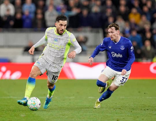 Liverpool, England, 4th May 2026. Rayan Cherki of Manchester City and James Garner of Everton during the Everton vs Manchester City Premier League match at Hill Dickinson Stadium, Liverpool. Picture credit should read: Andrew Yates Sportimage EDITORIAL USE ONLY. No use with unauthorised audio, video, data, fixture lists, club league logos or live services. Online in-match use limited to 120 images, no video emulation. No use in betting, games or single club league player publications. SPI_054_AY_Everton_Man_City SPI-4779-0054