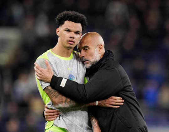 Liverpool, England, 4th May 2026. Pep Guardiola coach of Manchester City hugs Nico O™Reilly of Manchester City during the Everton vs Manchester City Premier League match at Hill Dickinson Stadium, Liverpool. Picture credit should read: Andrew Yates Sportimage EDITORIAL USE ONLY. No use with unauthorised audio, video, data, fixture lists, club league logos or live services. Online in-match use limited to 120 images, no video emulation. No use in betting, games or single club league player publications. SPI_055_AY_Everton_Man_City SPI-4779-0060