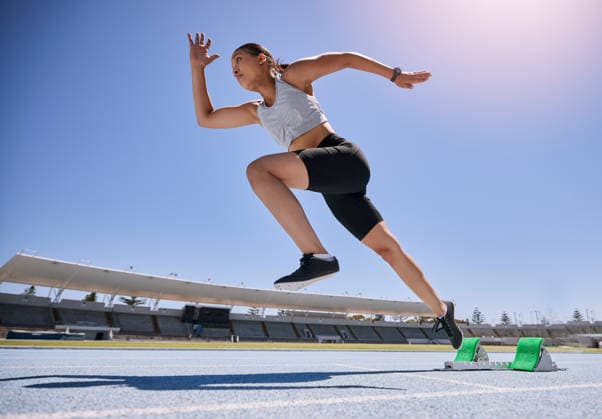 Woman runner, running and training on track, workout and exercise for race, marathon and in stadium. Speed, sports and fitness athlete with cardio, sprinter and fast run for Olympics event. (License=RF) 19962291 ,model released, Symbolfoto  Copyright: xZoonar.com YurixArcursxpeopleimages.comx 19962291 ,model released, Symbolfoto ,property released