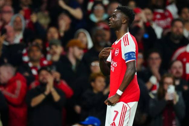 Bukayo Saka of Arsenal celebrates scoring the opening goal by pointing to his club badge Arsenal v Atletico Madrid, UEFA Champions League, Semi Final, Second Leg, Football, Emirates Stadium, London, UK - 05 May 2026London Emirates Stadium United Kingdom EDITORIAL USE ONLY No use with unauthorised audio, video, data, fixture lists, club league logos or live services. Online in-match use limited to 120 images, no video emulation. No use in betting, games or single club league player publications. Copyright: xJavierxGarcia Shutterstockx 16859995aa