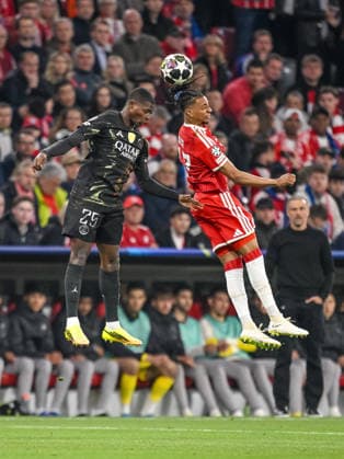 Nuno Mendes (Paris Saint-Germain FC) and Michael Olise (FC Bayern München) battle for the ball during the UEFA Champions League 2025 26 Semi Final Second Leg match between FC Bayern München and Paris Saint-Germain at Football Arena Munich on May 6, 2026 in Munich, Germany. (Photo by Harry Langer DeFodi Images) -