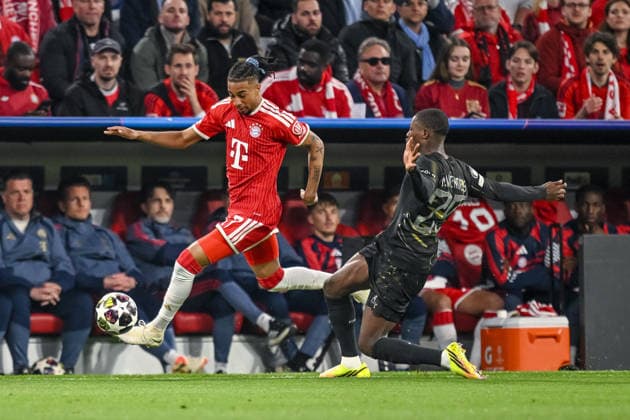 Michael Olise (FC Bayern München) and Nuno Mendes (Paris Saint-Germain FC) battle for the ball during the UEFA Champions League 2025 26 Semi Final Second Leg match between FC Bayern München and Paris Saint-Germain at Football Arena Munich on May 6, 2026 in Munich, Germany. (Photo by Harry Langer DeFodi Images) -