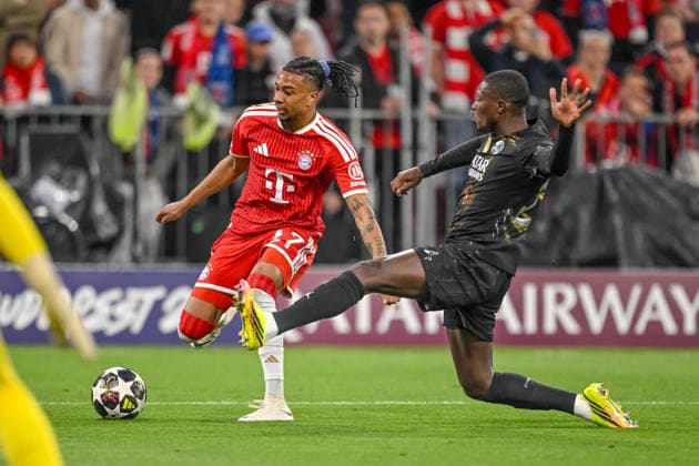 Michael Olise (FC Bayern München) and Nuno Mendes (Paris Saint-Germain FC) battle for the ball during the UEFA Champions League 2025 26 Semi Final Second Leg match between FC Bayern München and Paris Saint-Germain at Football Arena Munich on May 6, 2026 in Munich, Germany. (Photo by Harry Langer DeFodi Images) -