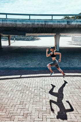 One mile at a time.. full length, Freisteller shot of an attractive and athletic young woman running through the city (License=RF) 20176633 ,model released, Symbolfoto  Copyright: xZoonar.com KasperxRavlox 20176633 ,model released, Symbolfoto ,property released
