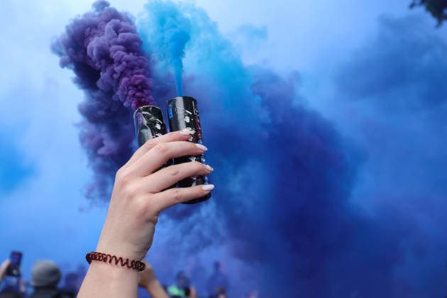 Aston Villa v Nottingham Forest 07 May 2026, Aston - UEFA EUROPA League - Semi Final - Second Leg - Aston Villa v Nottingham Forest - A fan holds a purple and blue smoke flare aloft - Photo: Charlotte Wilson Offside. Aston UK Copyright: xCharlottexWilsonx xOffsidexOffside