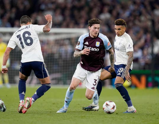 Birmingham, England, 7th May 2026. Victor Lindelof of Aston Villa finds a gap between Nicolas Dominguez of Nottingham Forest and Igor Jesus of Nottingham Forest during the Aston Villa vs Nottingham Forest UEFA Europa League semi final match 2nd leg match at Villa Park, Birmingham. Picture credit should read: Andrew Yates Sportimage EDITORIAL USE ONLY. No use with unauthorised audio, video, data, fixture lists, club league logos or live services. Online in-match use limited to 120 images, no video emulation. No use in betting, games or single club league player publications. SPI_080_AY_Villa_Forest SPI-4782-0081