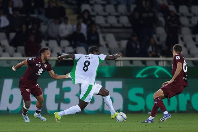 Turin, Italy, 8th May 2026. Enzo Ebosse of Torino FC tussles with Mbala Nzola of US Sassuolo as Gvidas Gineitis of Torino FC closes in during the Torino vs Sassuolo Serie A match at Stadio Grande Torino, Turin. Picture credit should read: Jonathan Moscrop Sportimage EDITORIAL USE ONLY. No use with unauthorised audio, video, data, fixture lists, club league logos or live services. Online in-match use limited to 120 images, no video emulation. No use in betting, games or single club league player publications. SPI_061_JM_TORO_SASSUOLO SPI-4758-0061