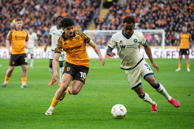 Hull City v Millwall Sky Bet Championship Mohamed Belloumi of Hull City challenges Zak Sturge of Millwall during the Sky Bet Championship Play-Off Semi-Final First Leg match between Hull City and Millwall at the MKM Stadium, Hull. 08 05 2026 UK Newspapers OUT Copyright: xMattxWilkinsonx FIL-23397-0185
