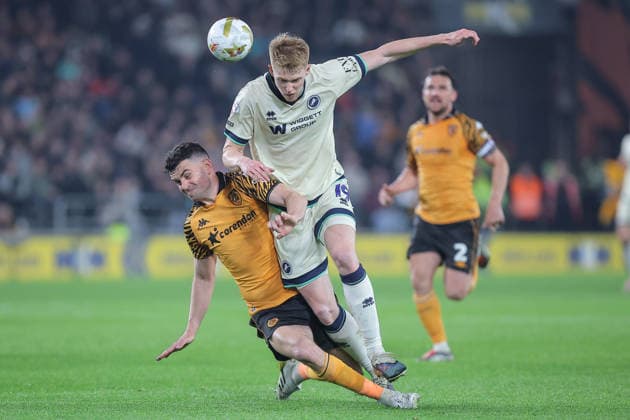 Hull City v Millwall Sky Bet Championship John Egan of Hull City and Duncan Watmore of Millwall challenge for the ball during the Sky Bet Championship Play-Off Semi-Final First Leg match at the MKM Stadium, Hull 08 05 2026 UK Newspapers OUT Copyright: xDavidxGreavesx FIL-23400-0038