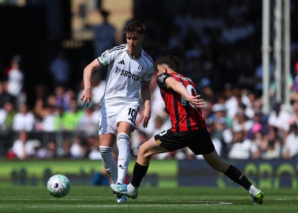 9th May 2026; Craven Cottage, Fulham, London, England; Premier League Football, Fulham versus Bournemouth; Tom Cairney of Fulham under pressure from Ryan Christie of AFC Bournemouth JPxFletcher