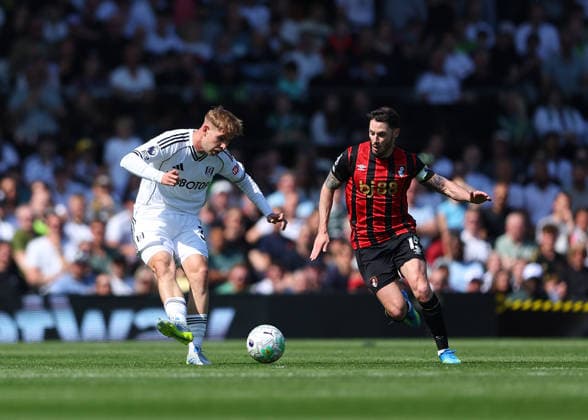 9th May 2026; Craven Cottage, Fulham, London, England; Premier League Football, Fulham versus Bournemouth; Emile Smith Rowe of Fulham under pressure from Adam Smith of AFC Bournemouth JPxFletcher