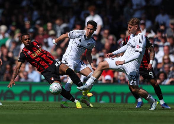 9th May 2026; Craven Cottage, Fulham, London, England; Premier League Football, Fulham versus Bournemouth; Eli Junior Kroupi of AFC Bournemouth under pressure from Emile Smith Rowe and Sasa Lukic of Fulham JPxFletcher