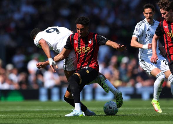 9th May 2026; Craven Cottage, Fulham, London, England; Premier League Football, Fulham versus Bournemouth; James Hill of AFC Bournemouth under pressure from Rodrigo Muniz of Fulham JPxFletcher