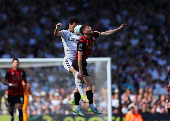 9th May 2026; Craven Cottage, Fulham, London, England; Premier League Football, Fulham versus Bournemouth; Sasa Lukic of Fulham and Ryan Christie of AFC Bournemouth compete for the ball mid-air JPxFletcher