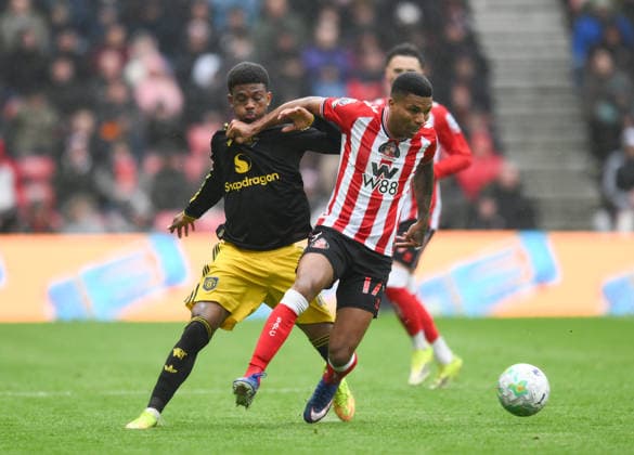 Reinildo Mandava of Sunderland fends off Amad Diallo of Manchester United, ManU during the Premier League 2025 26 League match between Sunderland and Manchester United at Stadium of Light on May 9th, 2026 in Sunderland, England. Copyright: xRichardxLee SportsxPressxPhotox Sportspressphoto_SPR143050