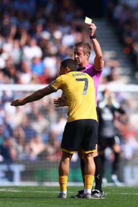 Brighton and Hove, England, 9th May 2026. Andre of Wolverhampton Wanderers is shown a yellow card during the Brighton and Hove Albion vs Wolverhampton Wanderers Premier League match at the AMEX Stadium, Brighton and Hove. Picture credit should read: Paul Terry Sportimage EDITORIAL USE ONLY. No use with unauthorised audio, video, data, fixture lists, club league logos or live services. Online in-match use limited to 120 images, no video emulation. No use in betting, games or single club league player publications. SPI_046_PT_Brighton_Wolves SPI-4789-0046