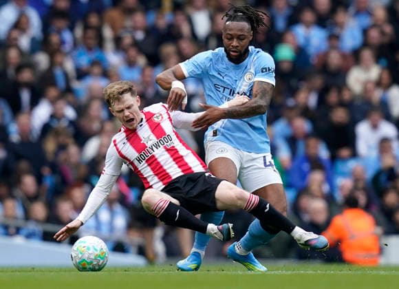 Manchester, England, 9th May 2026. Keane Lewis-Potter of Brentford (L) is challenged by Antoine Semenyo of Manchester City during the Manchester City vs Brentford Premier League match at the Etihad Stadium, Manchester. Picture credit should read: Andrew Yates Sportimage EDITORIAL USE ONLY. No use with unauthorised audio, video, data, fixture lists, club league logos or live services. Online in-match use limited to 120 images, no video emulation. No use in betting, games or single club league player publications. SPI_008_AY_MAN_CITY_BRENTFORD SPI-4788-0012