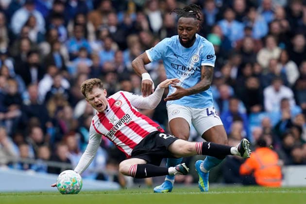 Manchester, England, 9th May 2026. Keane Lewis-Potter of Brentford (L) is challenged by Antoine Semenyo of Manchester City during the Manchester City vs Brentford Premier League match at the Etihad Stadium, Manchester. Picture credit should read: Andrew Yates Sportimage EDITORIAL USE ONLY. No use with unauthorised audio, video, data, fixture lists, club league logos or live services. Online in-match use limited to 120 images, no video emulation. No use in betting, games or single club league player publications. SPI_009_AY_MAN_CITY_BRENTFORD SPI-4788-0013
