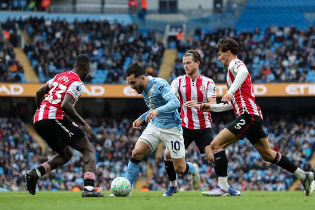 Premier League: Manchester City v Brentford Rayan Cherki of Manchester City dribbles past Michael Kayode of Brentford and Aaron Hickey of Brentford during the Premier League match Manchester City vs Brentford at The City in the Community Etihad Stadium, Manchester, United Kingdom on 09 May 2026 (Photo by Jorge Horsted News Images) Manchester The City in the Community Etihad Stadium Greater Manchester United, ManU Kingdom Copyright: xJorgexHorsted NewsxImagesx