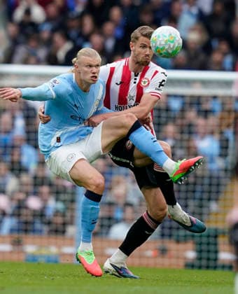 Manchester, England, 9th May 2026. Kristoffer Ajer of Brentford (R) challenges Erling Haaland of Manchester City during the Manchester City vs Brentford Premier League match at the Etihad Stadium, Manchester. Picture credit should read: Andrew Yates Sportimage EDITORIAL USE ONLY. No use with unauthorised audio, video, data, fixture lists, club league logos or live services. Online in-match use limited to 120 images, no video emulation. No use in betting, games or single club league player publications. SPI_023_AY_MAN_CITY_BRENTFORD SPI-4788-0027