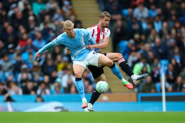 9th May 2026; Etihad Stadium, Manchester, Lancashire, England; Premier League Football, Manchester City versus Brentford; Erling Haaland of Manchester City is under pressure from Kristoffer Ajer of Brentford RogerxEvans