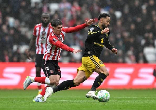 Trai Hume of Sunderland and Matheus Cunha of Manchester United, ManU Sunderland v Manchester United, Premier League, Football, Stadium of Light, Sunderland , UK - 09 May 2026Sunderland Stadium of Light United Kingdom EDITORIAL USE ONLY No use with unauthorised audio, video, data, fixture lists, club league logos or live services. Online in-match use limited to 120 images, no video emulation. No use in betting, games or single club league player publications. Copyright: xAnnaxGowthorpe Shutterstockx 16861687aw