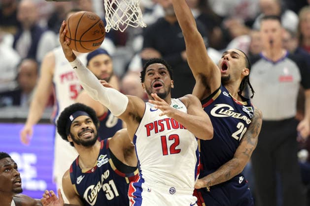 Detroit Pistons Tobias Harris (12) puts up a shot while defended by Cleveland Cavaliers Jarrett Allen (31) and Jaylon Tyson (20) in the first quarter in Cleveland, Ohio Saturday May 9, 2026.  CLE20260509104 AARONxJOSEFCZYK