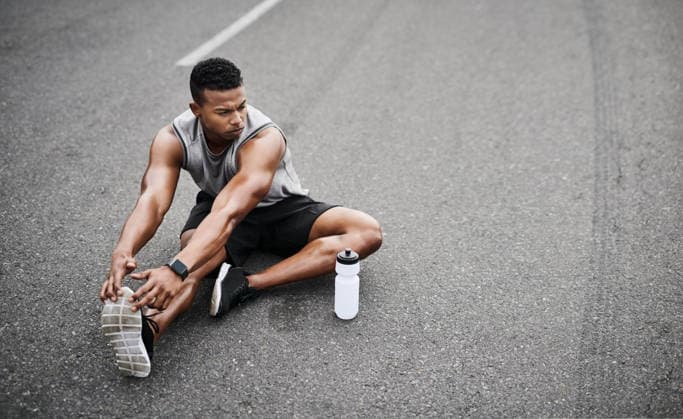 His determination is unfaltering. a sporty young man stretching his legs while exercising outdoors (License=RF) 20287126 ,model released, Symbolfoto  Copyright: xZoonar.com YurixArcursxpeopleimages.comx 20287126 ,model released, Symbolfoto ,property released
