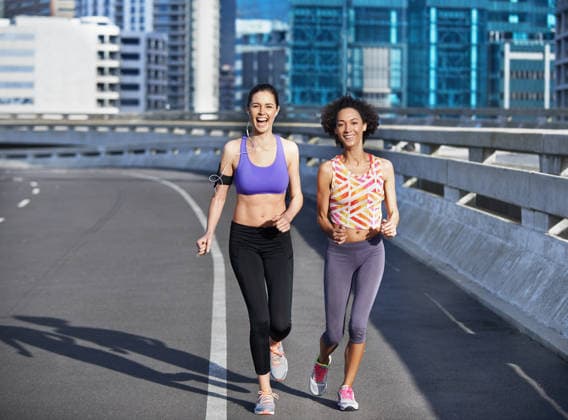 Running isnt just about fitness. two friends jogging together through the city streets (License=RF) 20318904 ,model released, Symbolfoto  Copyright: xZoonar.com KasperxRavlox 20318904 ,model released, Symbolfoto ,property released