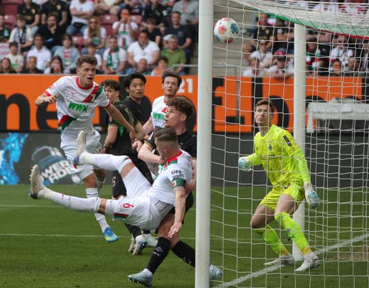 (260510) -- AUGSBURG, May 10, 2026 -- Moritz Nicolas (1st R), goalkeeper of Borussia Moenchengladbach, fails to make a save during the German first division Bundesliga football match between FC Augsburg and Borussia Moenchengladbach in Augsburg, Germany, May 9, 2026. (Photo by Xinhua) (SP)GERMANY-AUGSBURG-FOOTBALL-BUNDESLIGA-AUGSBURG VS MOENCHENGLADBACH PhilippexRuiz 