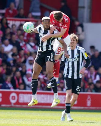 Nottingham, England, 10th May 2026. Joelinton of Newcastle United (L) is challenged by Elliot Anderson of Nottingham Forest during the Nottingham Forest vs Newcastle United Premier League match at the City Ground, Nottingham. Picture credit should read: Andrew Yates Sportimage EDITORIAL USE ONLY. No use with unauthorised audio, video, data, fixture lists, club league logos or live services. Online in-match use limited to 120 images, no video emulation. No use in betting, games or single club league player publications. SPI_015_AY_NOTTS_FOREST_NEWC SPI-4792-0015