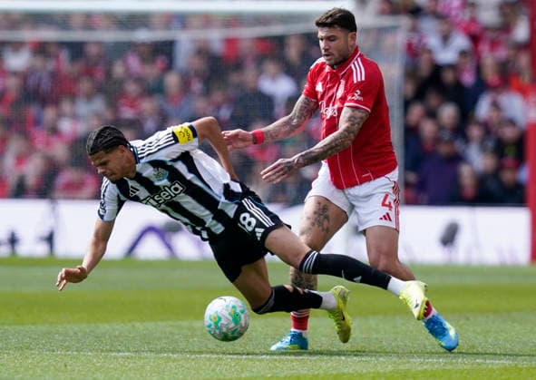 Nottingham, England, 10th May 2026. William Osula of Newcastle United (L) is challenged by Morato of Nottingham Forest during the Nottingham Forest vs Newcastle United Premier League match at the City Ground, Nottingham. Picture credit should read: Andrew Yates Sportimage EDITORIAL USE ONLY. No use with unauthorised audio, video, data, fixture lists, club league logos or live services. Online in-match use limited to 120 images, no video emulation. No use in betting, games or single club league player publications. SPI_043_AY_NOTTS_FOREST_NEWC SPI-4792-0043