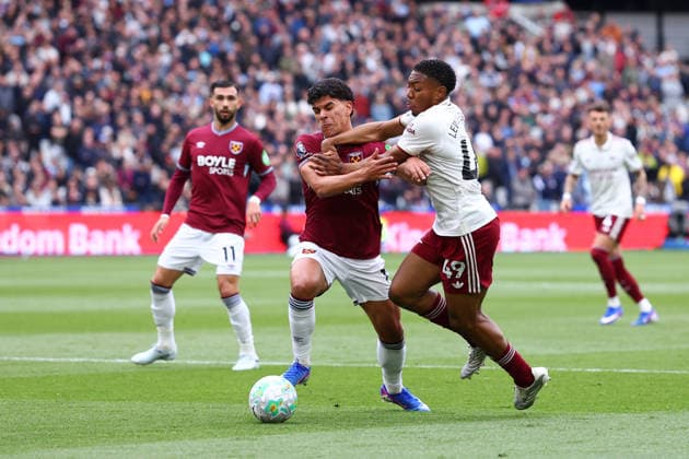 London, England, 10th May 2026. Mateus Fernandes of West Ham United and Myles Lewis-Skelly of Arsenal challenge for the ball during the West Ham United vs Arsenal Premier League match at the London Stadium, London. Picture credit should read: Paul Terry Sportimage EDITORIAL USE ONLY. No use with unauthorised audio, video, data, fixture lists, club league logos or live services. Online in-match use limited to 120 images, no video emulation. No use in betting, games or single club league player publications. SPI_013_PT_West_Ham_Arsenal SPI-4793-0013