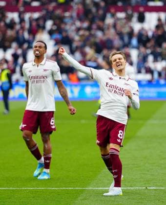 Martin Odegaard and Gabriel Magalhaes of Arsenal celebrate at full time West Ham United v Arsenal, Premier League, Football, London Stadium, London , UK - 10 May 2026London London Stadium United Kingdom EDITORIAL USE ONLY No use with unauthorised audio, video, data, fixture lists, club league logos or live services. Online in-match use limited to 120 images, no video emulation. No use in betting, games or single club league player publications. Copyright: xJavierxGarcia Shutterstockx 16861795av