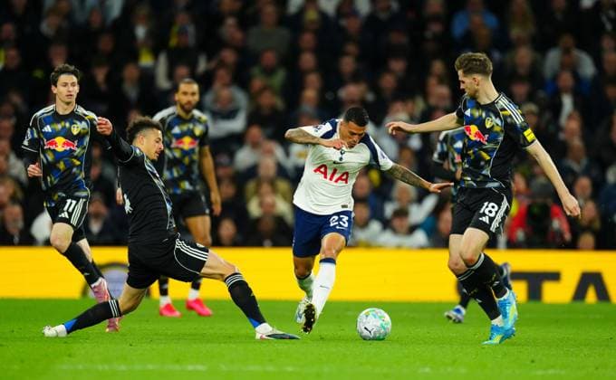 Pedro Porro of Tottenham Hotspur looks for a gap between Ethan Ampadu and Joe Rodon of Leeds United Tottenham Hotspur v Leeds United, Premier League, Football, Tottenham Hotspur Stadium, London , UK - 11 May 2026London Tottenham Hotspur Stadium United Kingdom EDITORIAL USE ONLY No use with unauthorised audio, video, data, fixture lists, club league logos or live services. Online in-match use limited to 120 images, no video emulation. No use in betting, games or single club league player publications. Copyright: xJavierxGarcia Shutterstockx 16869644fb