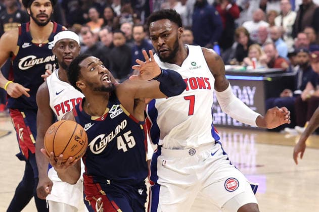 Cleveland Cavaliers Donovan Mitchell (45) drives to the basket while defended by Detroit Pistons Paul Reed (7) in the fourth quarter in Cleveland, Ohio Monday May 11, 2026. The Cavaliers defeated the Pistons 112-103 to tie the series at 2 games each.  CLE20260511112 AARONxJOSEFCZYK