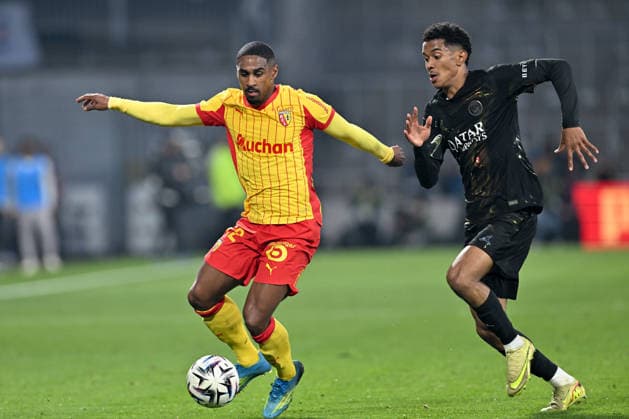 260513 RC Lens vs PSG Wesley Said (22) of RC Lens fighting for the ball with Senny Mayulu (24) of PSG during the French Mc Donalds Ligue 1 season 2025 - 2026 matchday 29 game between Racing Club De Lens and Paris Saint-Germain on May 13 , 2026 in Lens, France. (Photo by David Catry Isosport) Lens France  Copyright: xDavidxCatryx 20260513DC2_3447